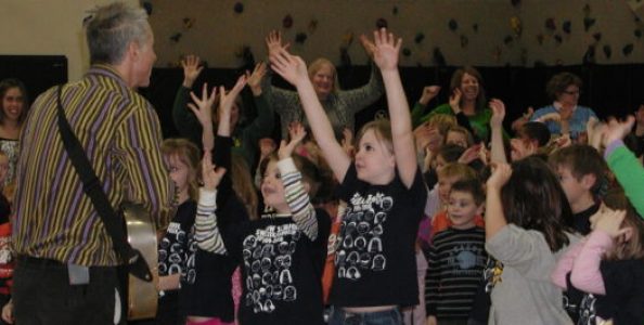 kids enjoying performance of Stuart Stotts - engaged, hands in the air like they just don't care